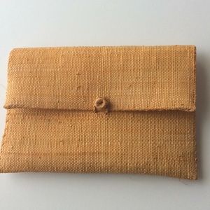 Millennial yellow raffia clutch